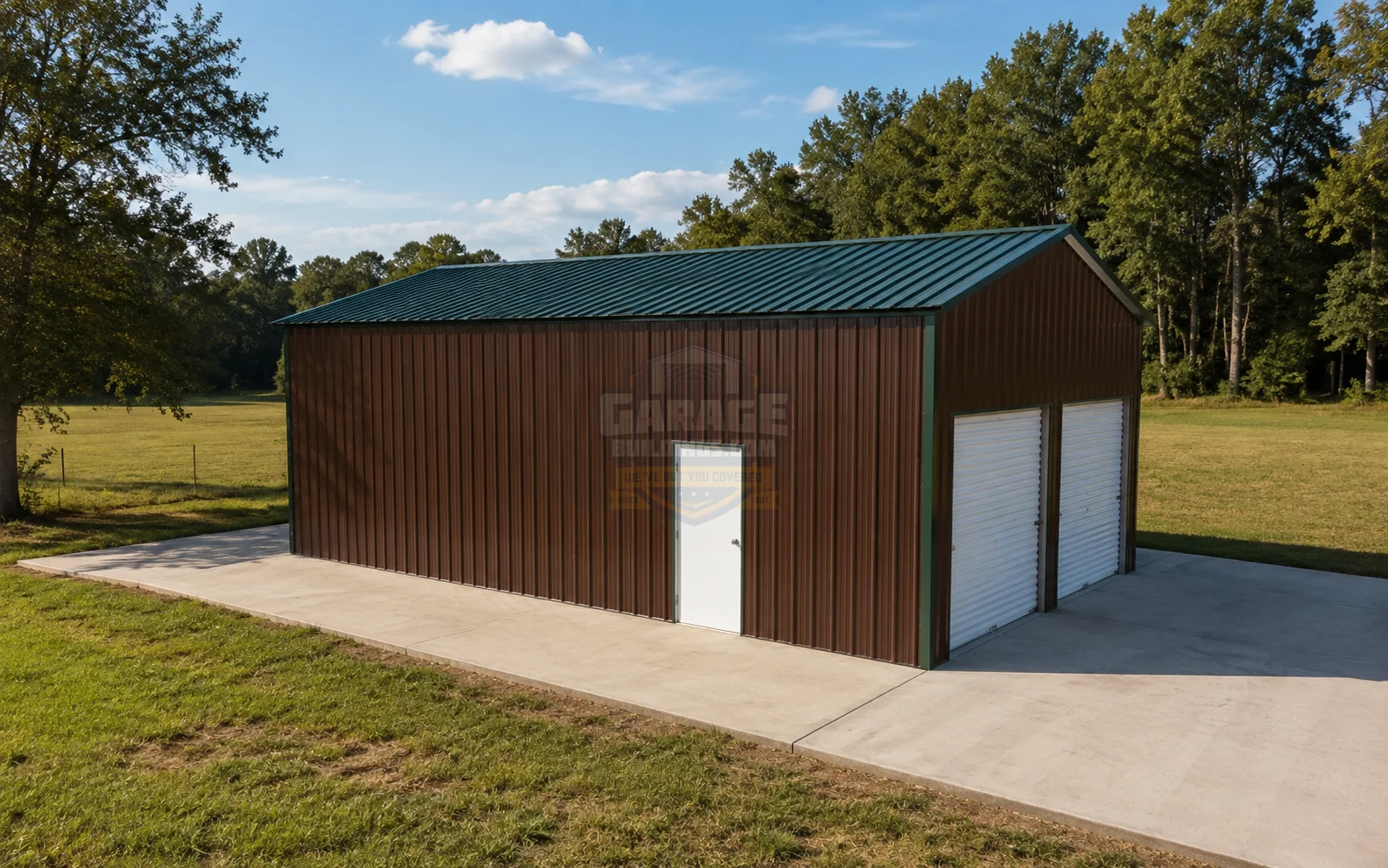 Metal garage building with a green roof, set in a grassy field
