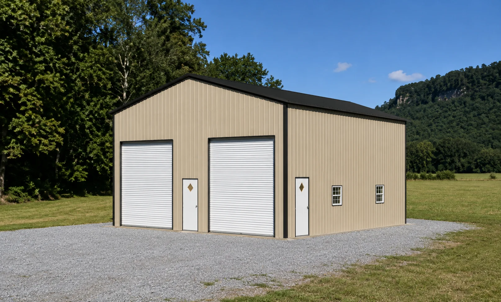 Large metal storage building with two roll-up doors on a grassy area