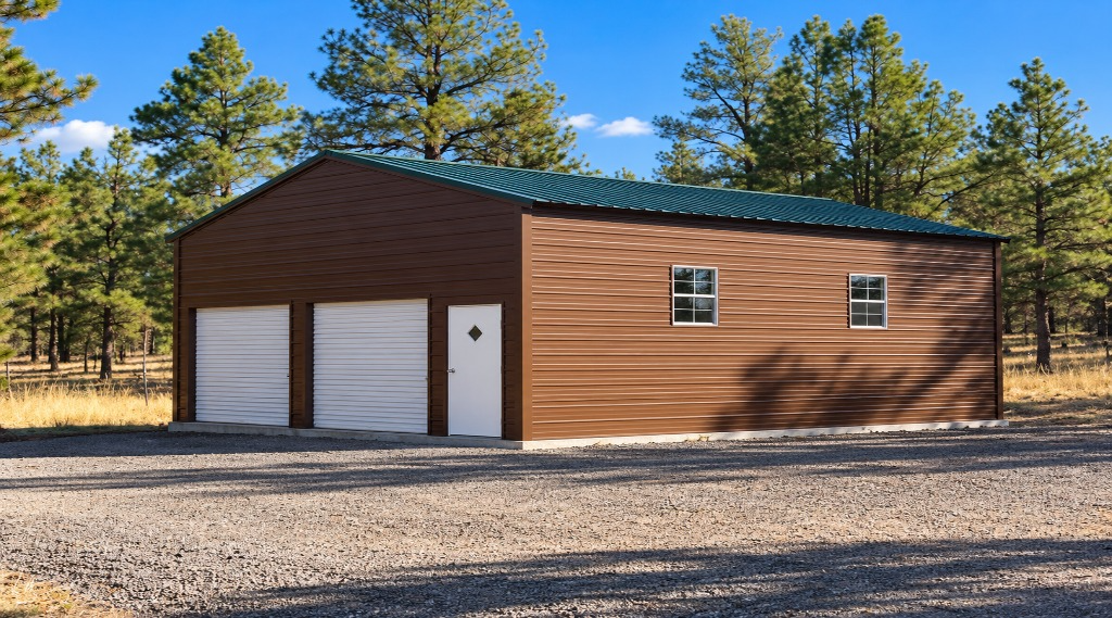 Brown storage building with a green roof in a wooded area