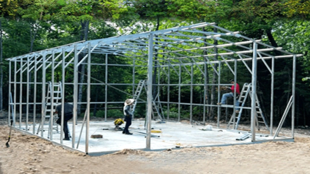 Construction workers assembling a metal framework for a building in a wooded area
