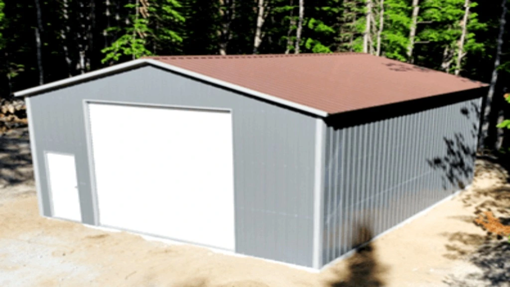 Metal storage building with a red roof in a wooded area